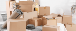 cartons de déménagement accumulés lors d’une mobilité professionnelle sans accompagnement